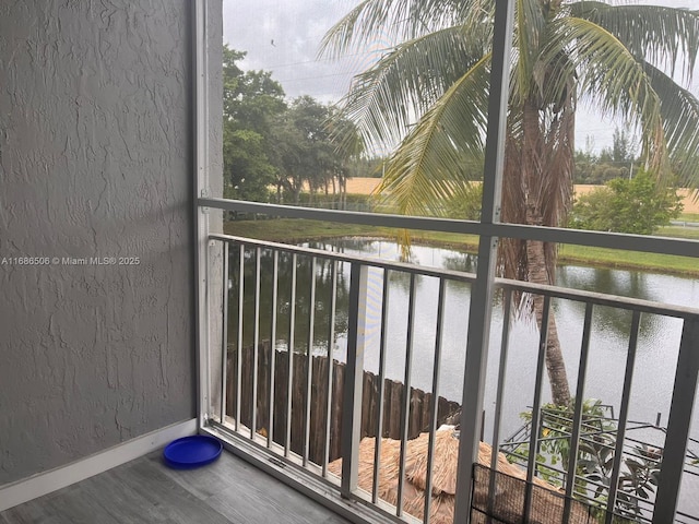 balcony featuring a water view