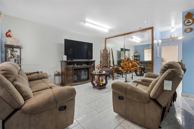 tiled living room featuring a high end fireplace