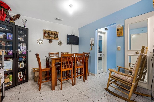 view of tiled dining space