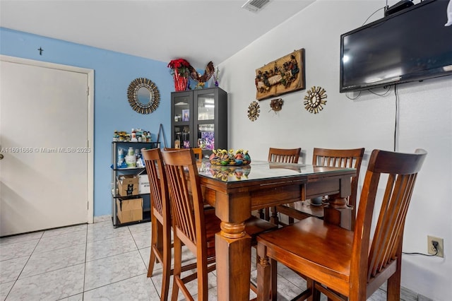 dining room with light tile patterned floors