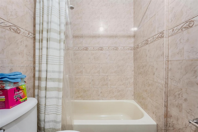 bathroom featuring toilet and shower / bath combo