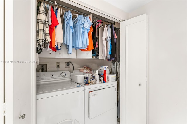 laundry area with separate washer and dryer