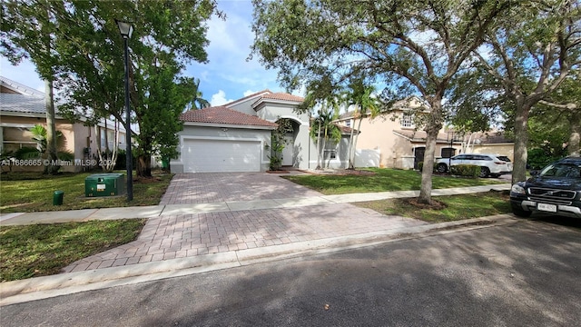 view of front facade with central AC unit, a garage, and a front lawn