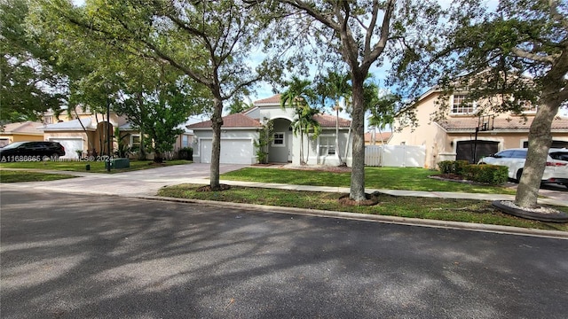 view of front facade with a garage and a front yard