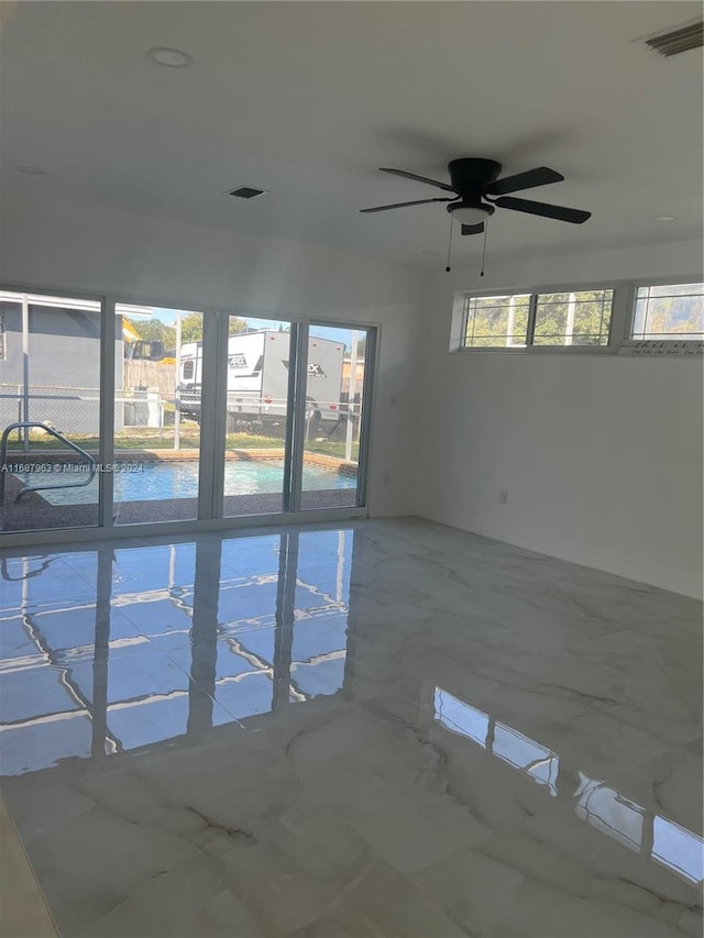 unfurnished room featuring ceiling fan