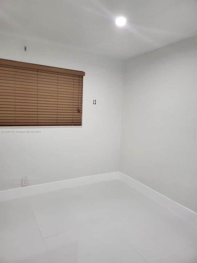 empty room featuring tile patterned floors