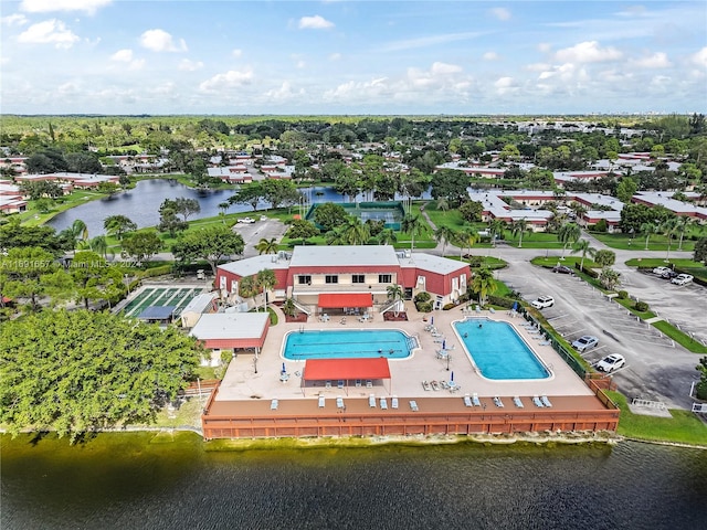 birds eye view of property with a water view