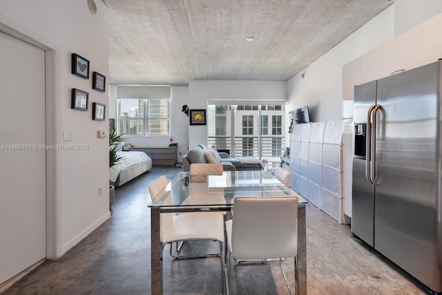 dining space with concrete floors