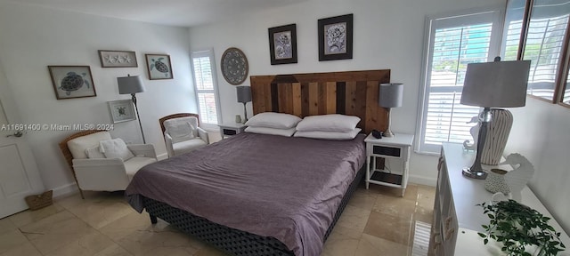 bedroom with multiple windows