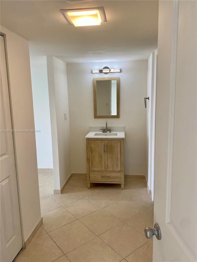 bathroom with tile patterned flooring and vanity