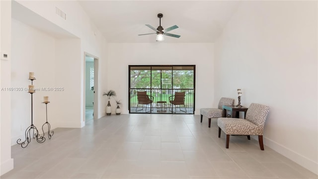 sitting room featuring ceiling fan, visible vents, and baseboards