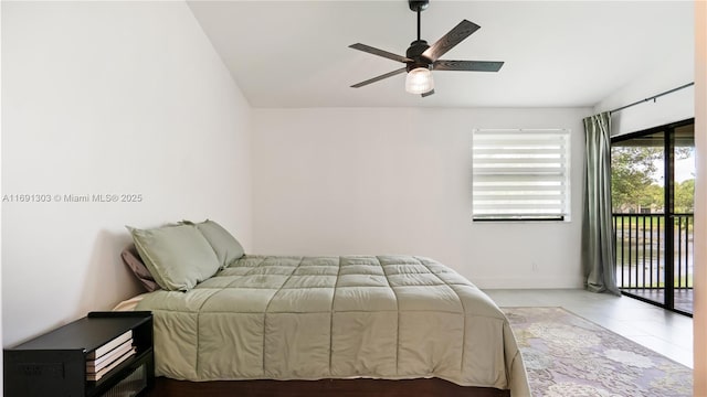 bedroom featuring access to exterior, lofted ceiling, and a ceiling fan