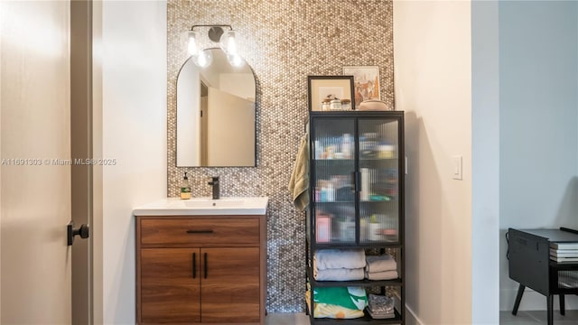 bathroom with vanity and baseboards