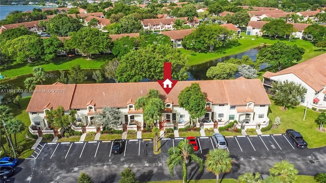 bird's eye view featuring a water view and a residential view