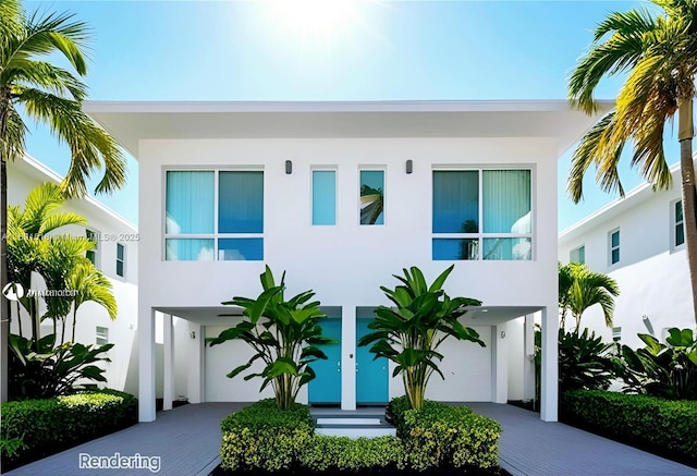 exterior space with decorative driveway and a garage