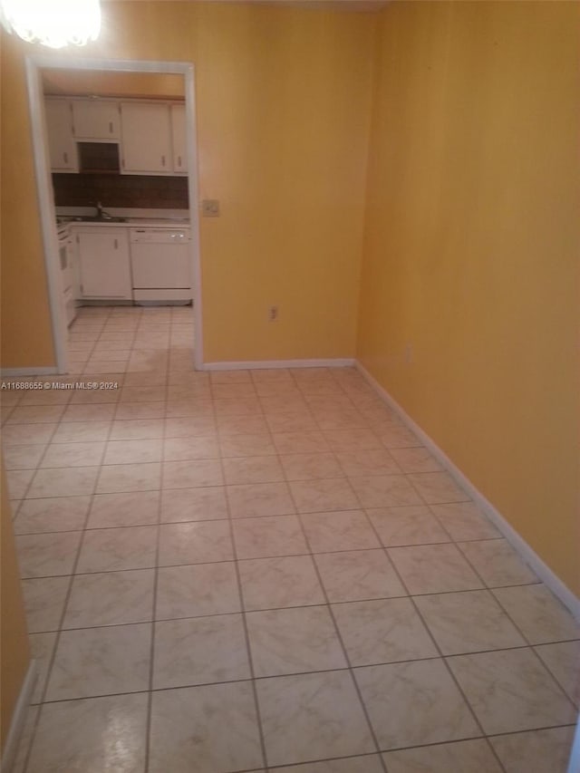 tiled empty room with sink