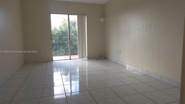 spare room with light tile patterned floors