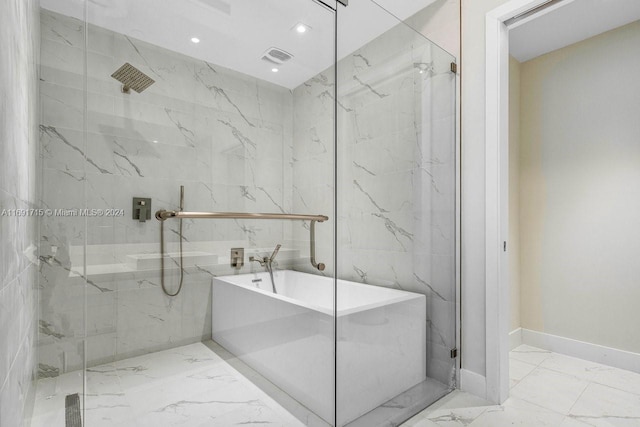 bathroom with shower with separate bathtub