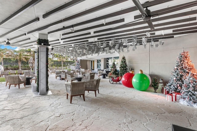 view of patio featuring a pergola, outdoor lounge area, and ceiling fan