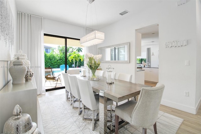 dining room with light hardwood / wood-style flooring