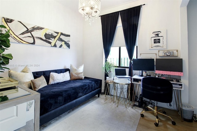 bedroom with a notable chandelier and wood-type flooring