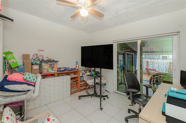 office featuring ceiling fan, a textured ceiling, and light tile patterned floors