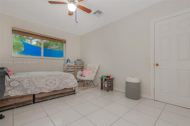 tiled bedroom with ceiling fan