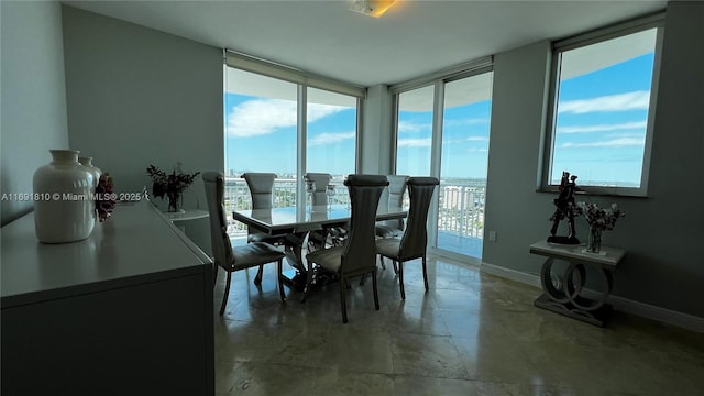 dining room featuring floor to ceiling windows