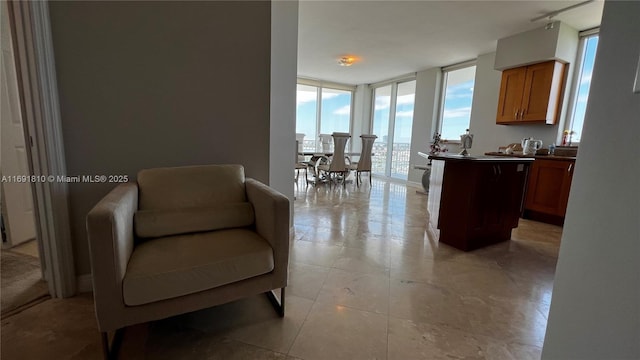 sitting room with floor to ceiling windows