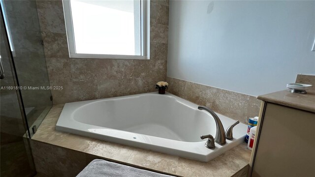 bathroom with tiled bath