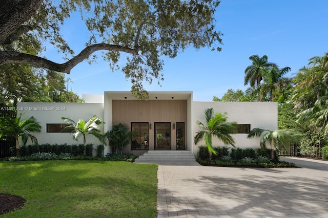 11150 Griffing Blvd, Biscayne Park, FL 33161 - view of front of house featuring a front lawn and stucco siding