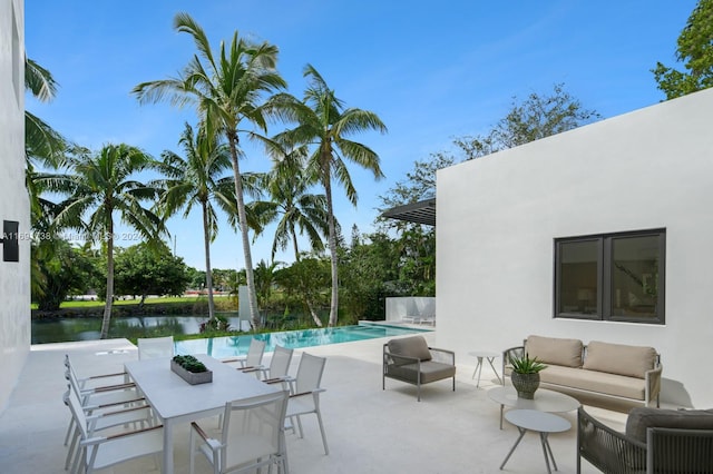 view of patio / terrace featuring an outdoor hangout area and a water view