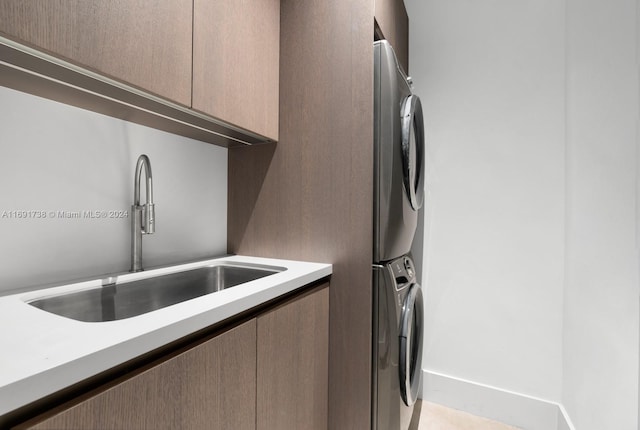 11150 Griffing Blvd, Biscayne Park, FL 33161 - laundry room featuring cabinet space and estacked washer and dryer