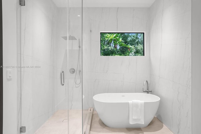 11150 Griffing Blvd, Biscayne Park, FL 33161 - full bathroom featuring a marble finish shower, a freestanding tub, and tile walls