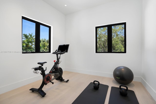 11150 Griffing Blvd, Biscayne Park, FL 33161 - workout area featuring healthy amount of natural light, wood finished floors, baseboards, and recessed lighting
