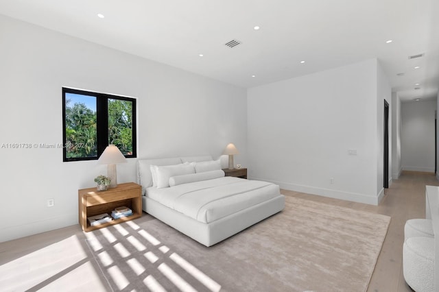 bedroom with light hardwood / wood-style flooring