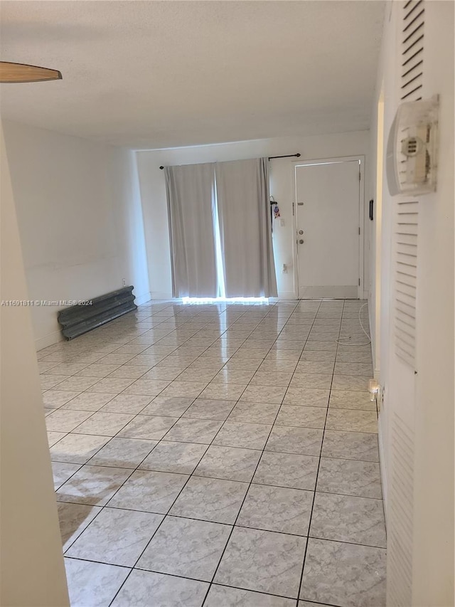 interior space featuring light tile patterned floors