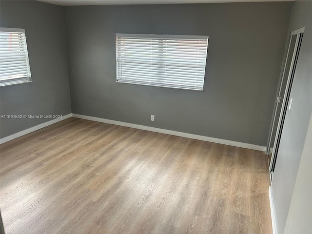 unfurnished room featuring light wood-type flooring