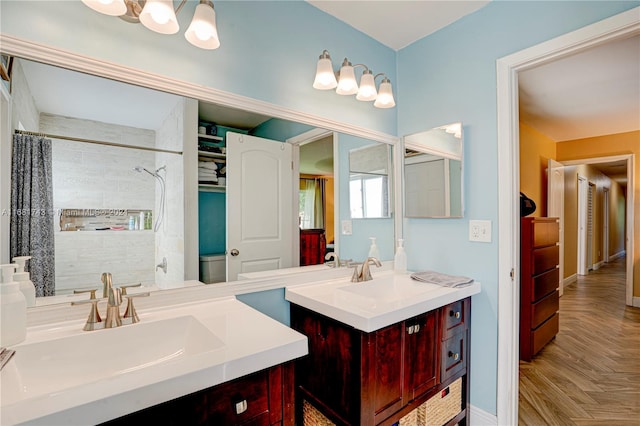 bathroom featuring toilet, a shower with curtain, vanity, and parquet floors