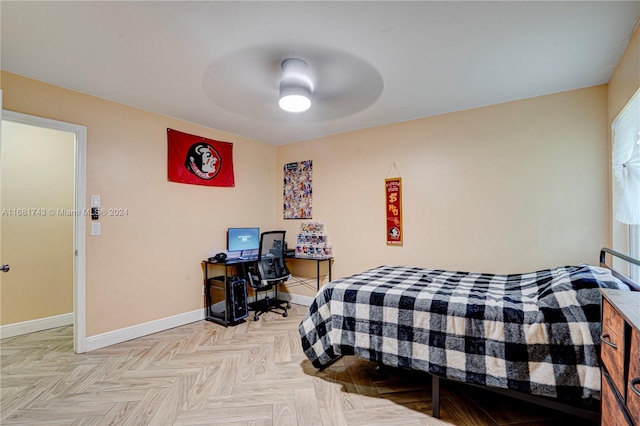 bedroom with ceiling fan and light parquet floors