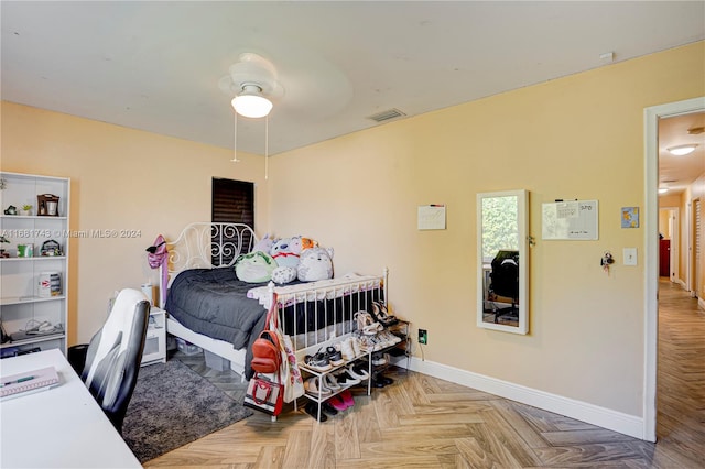 bedroom with ceiling fan and light parquet floors