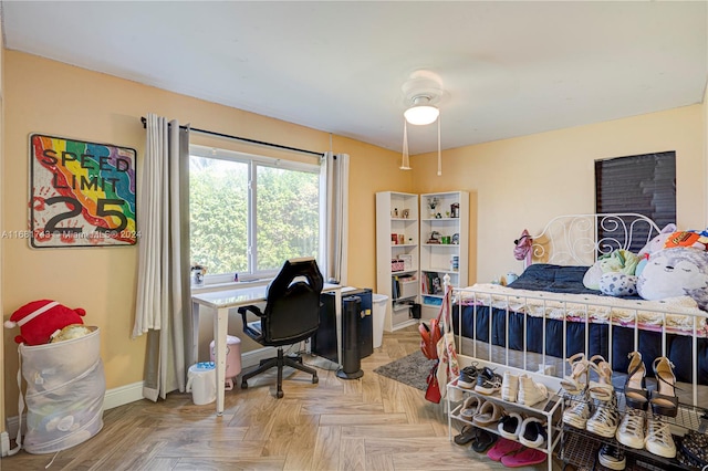 bedroom with parquet floors and ceiling fan