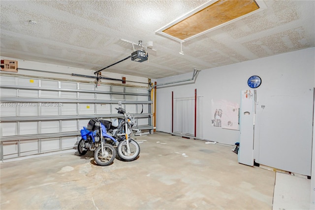 garage featuring a garage door opener