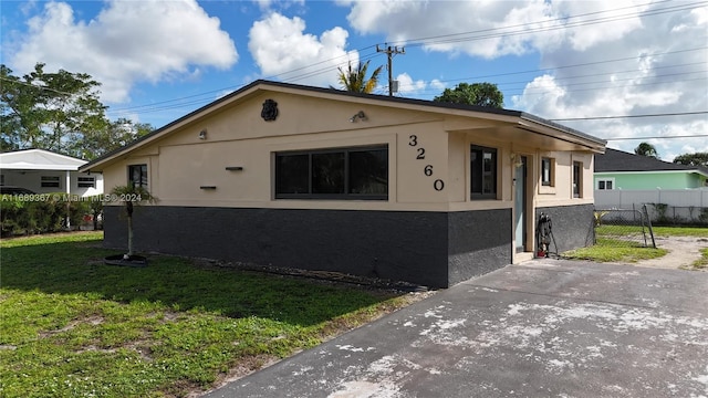 view of property exterior with a yard