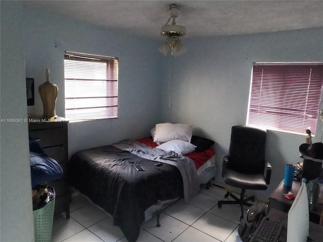 bedroom featuring light tile patterned flooring