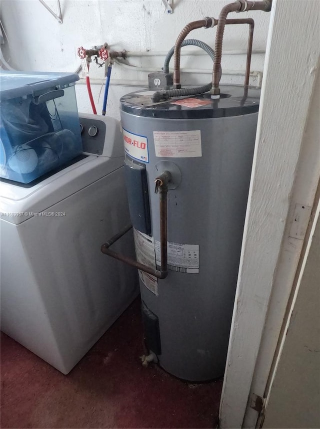 utility room featuring water heater and washer / clothes dryer