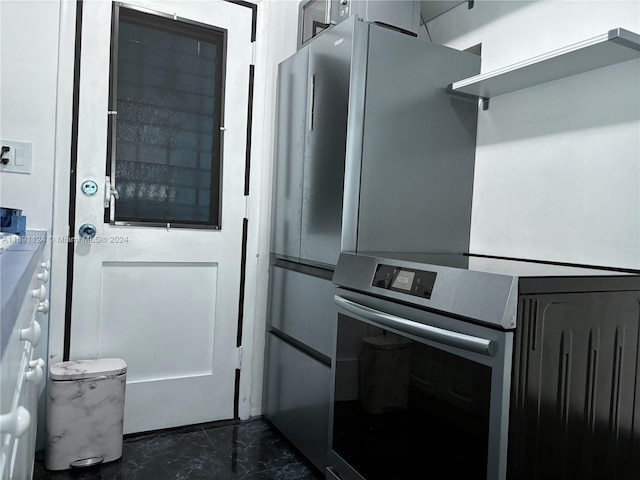 1395 NE 167th St Unit 315, Miami, FL 33162 - kitchen with wall oven and dark marble finish floors