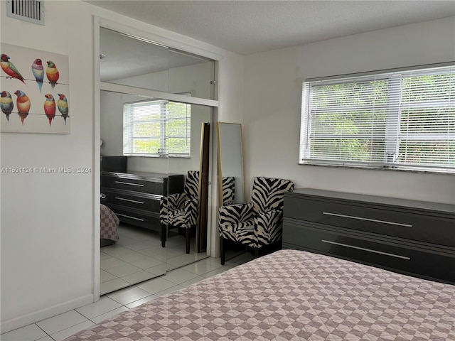 1395 NE 167th St Unit 315, Miami, FL 33162 - bedroom featuring light tile patterned floors and a closet