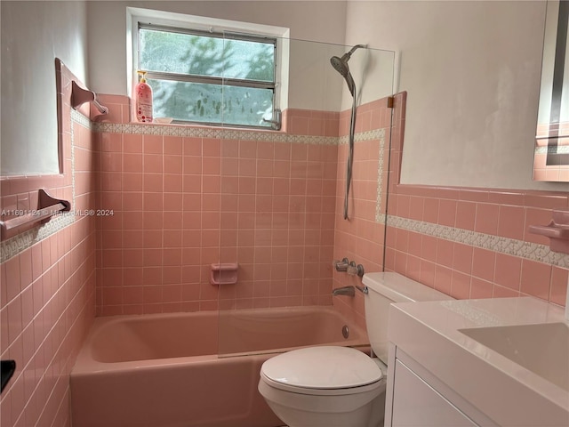 1395 NE 167th St Unit 315, Miami, FL 33162 - full bathroom featuring tile walls, toilet, vanity, shower / tub combination, and wainscoting