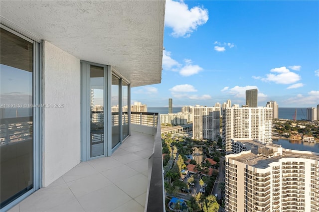 balcony featuring a water view